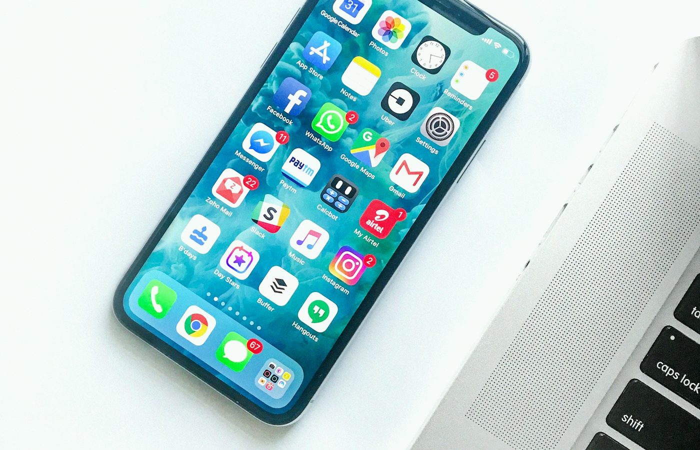 Phone with apps next to a laptop, works on every device